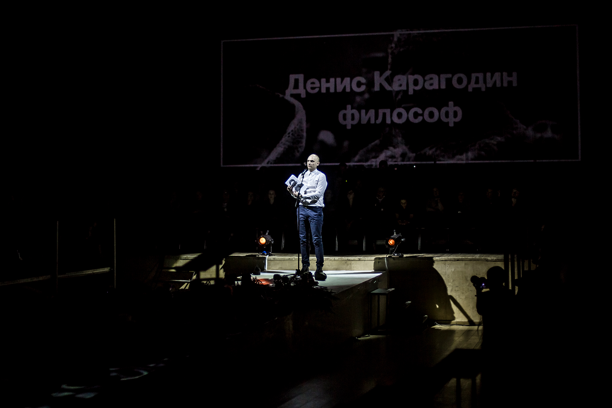 Denis Karagodin speaking on stage during the performance “Funeral of Stalin,” Gogol Center, Moscow.