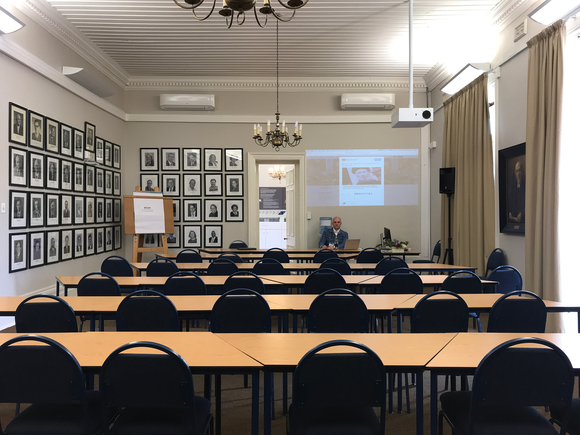 Denis Karagodin in the conference hall at Stellenbosch University shortly before his presentation, as participants begin to arrive.