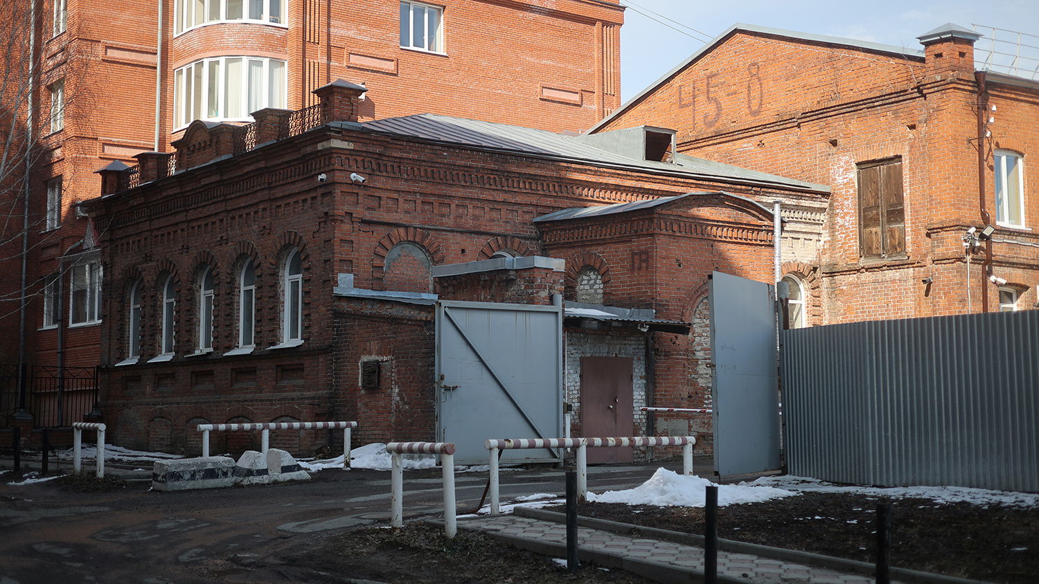 Garage complex of the Ministry of Internal Affairs of the Russian Federation (Center for Economic and Service Support of the MVD for the Tomsk Region). This is the facility referenced in the official explanation for the dismantling of the Stone of Sorrow memorial. In 1937–1938, during the Great Terror, it served as the base for the Tomsk NKVD’s "black vans." The complex remains active today.