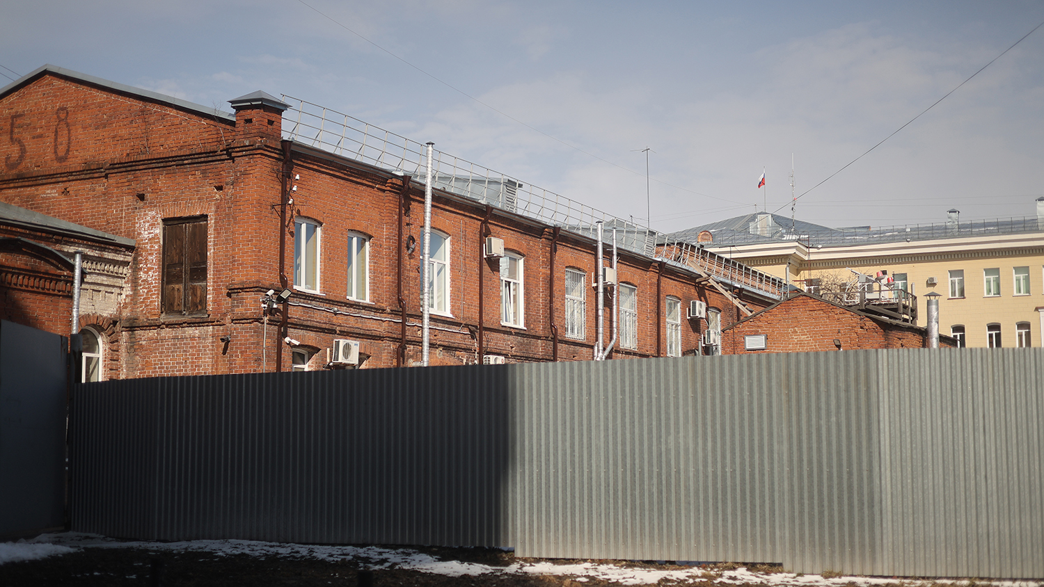 Garage complex of the Ministry of Internal Affairs of the Russian Federation (Center for Economic and Service Support of the MVD for the Tomsk Region). This is the facility referenced in the official explanation for the dismantling of the Stone of Sorrow memorial. In 1937–1938, during the Great Terror, it served as the base for the Tomsk NKVD’s "black vans." The complex remains active today.